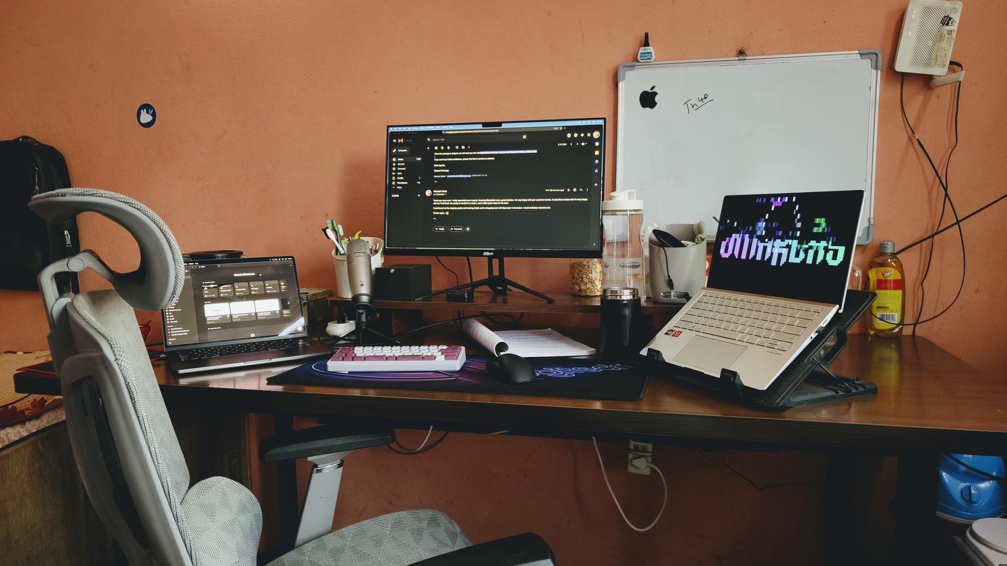 Workspace desk setup with monitor and gear